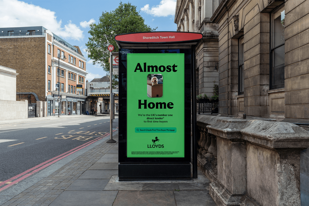 Lloyds 'Almost Home' digital bus stop panel on a Shoreditch street