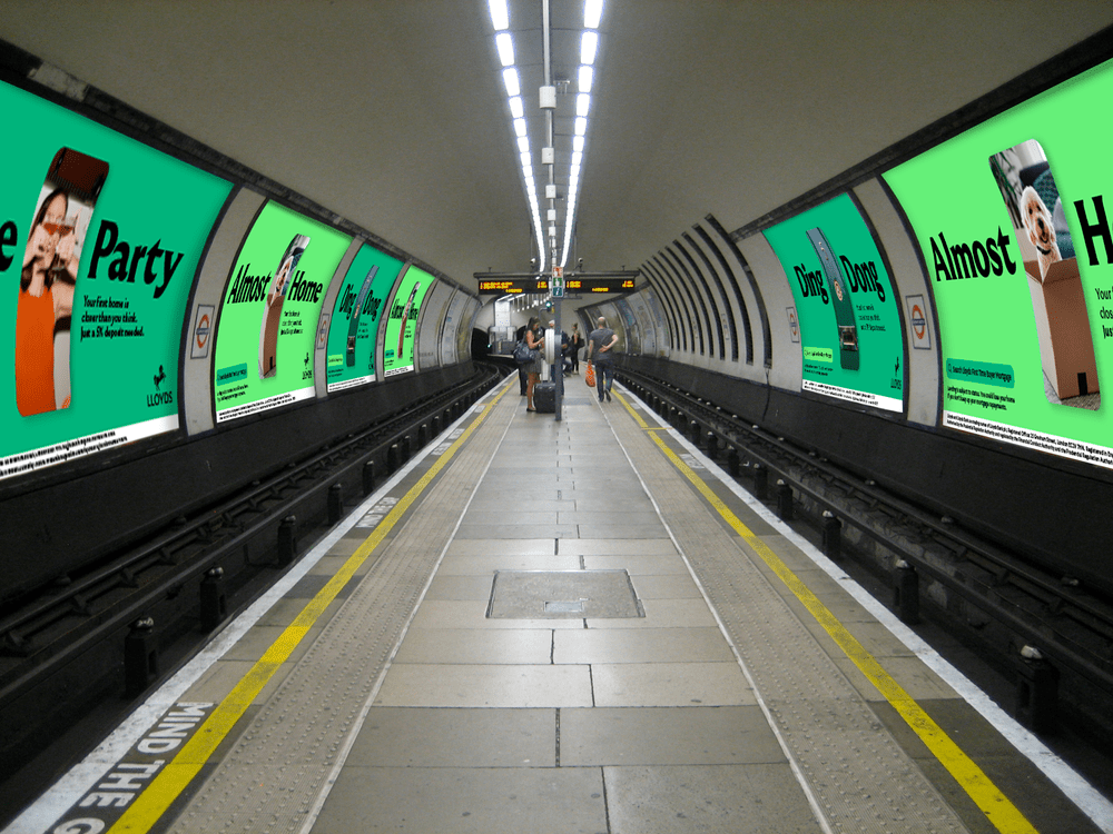 Lloyds 'Almost Home' Tube platform takeover, both tunnel walls wrapped in green campaign artwork