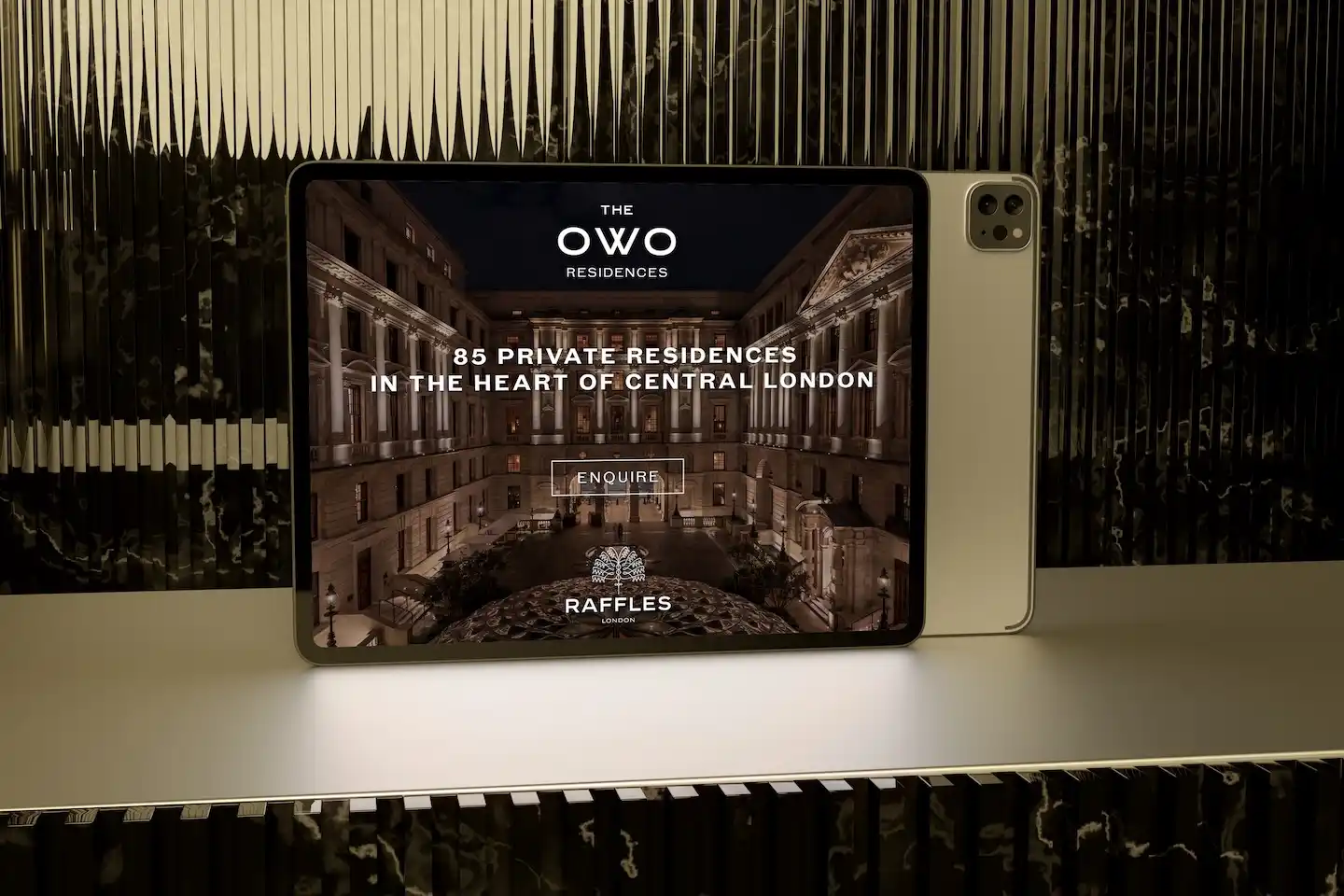 The OWO Residences website shown on an iPad: 85 private residences in the heart of central London