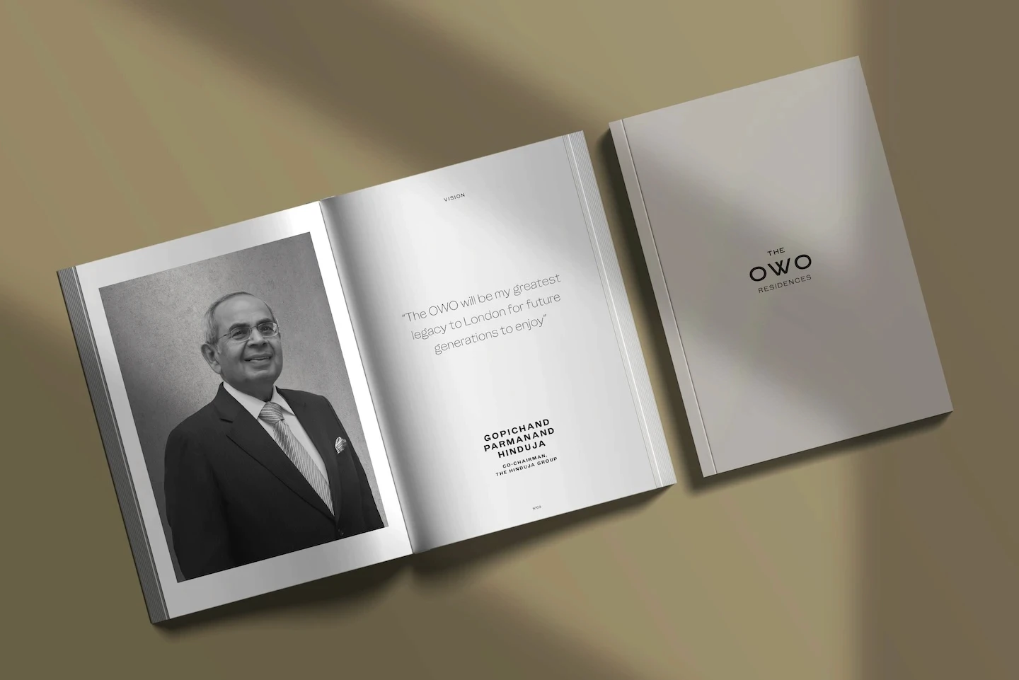 The OWO vision spread with a chairman portrait, alongside the OWO Residences cover